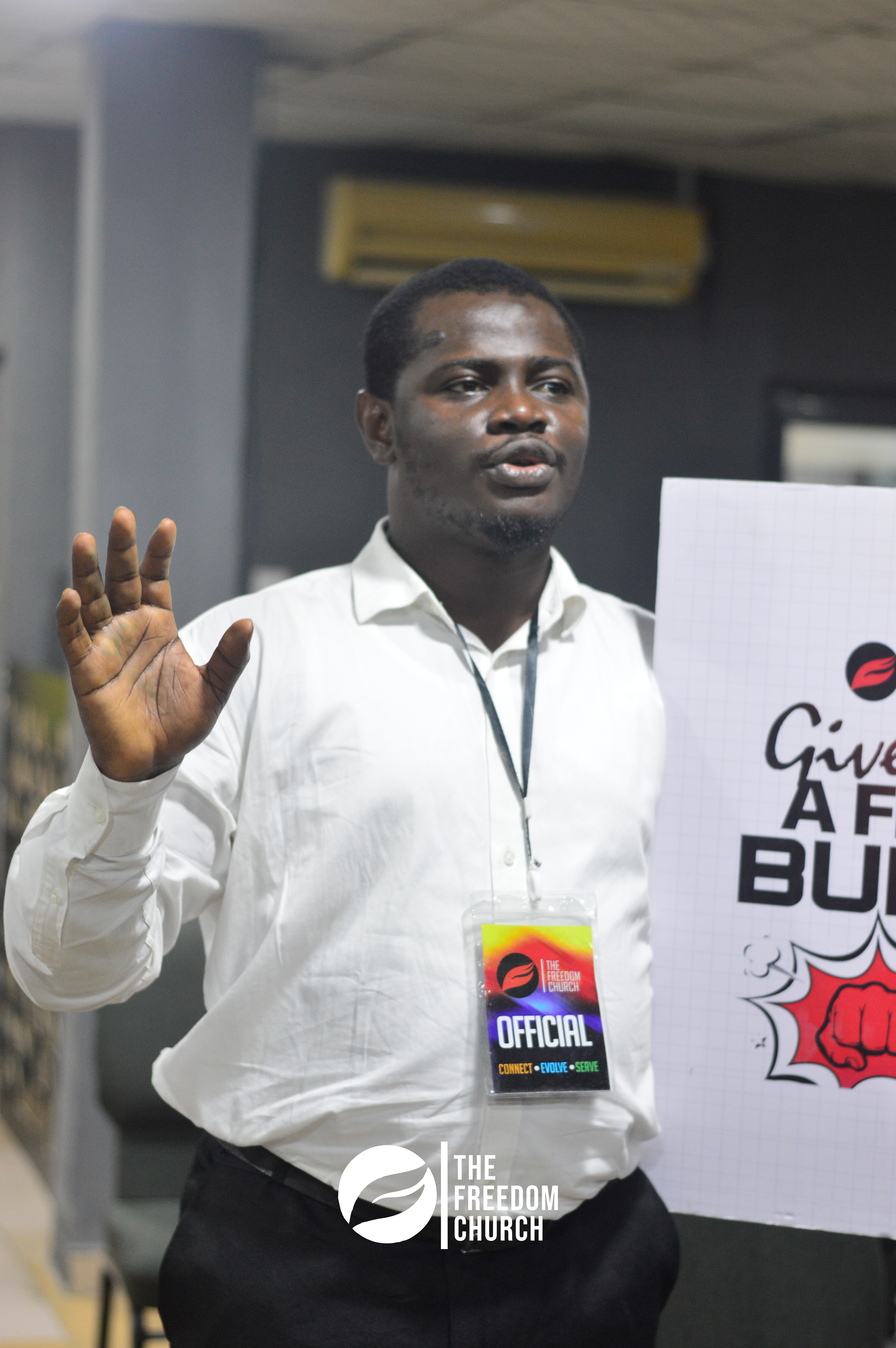 A Freedom Church volunteer with an official badge