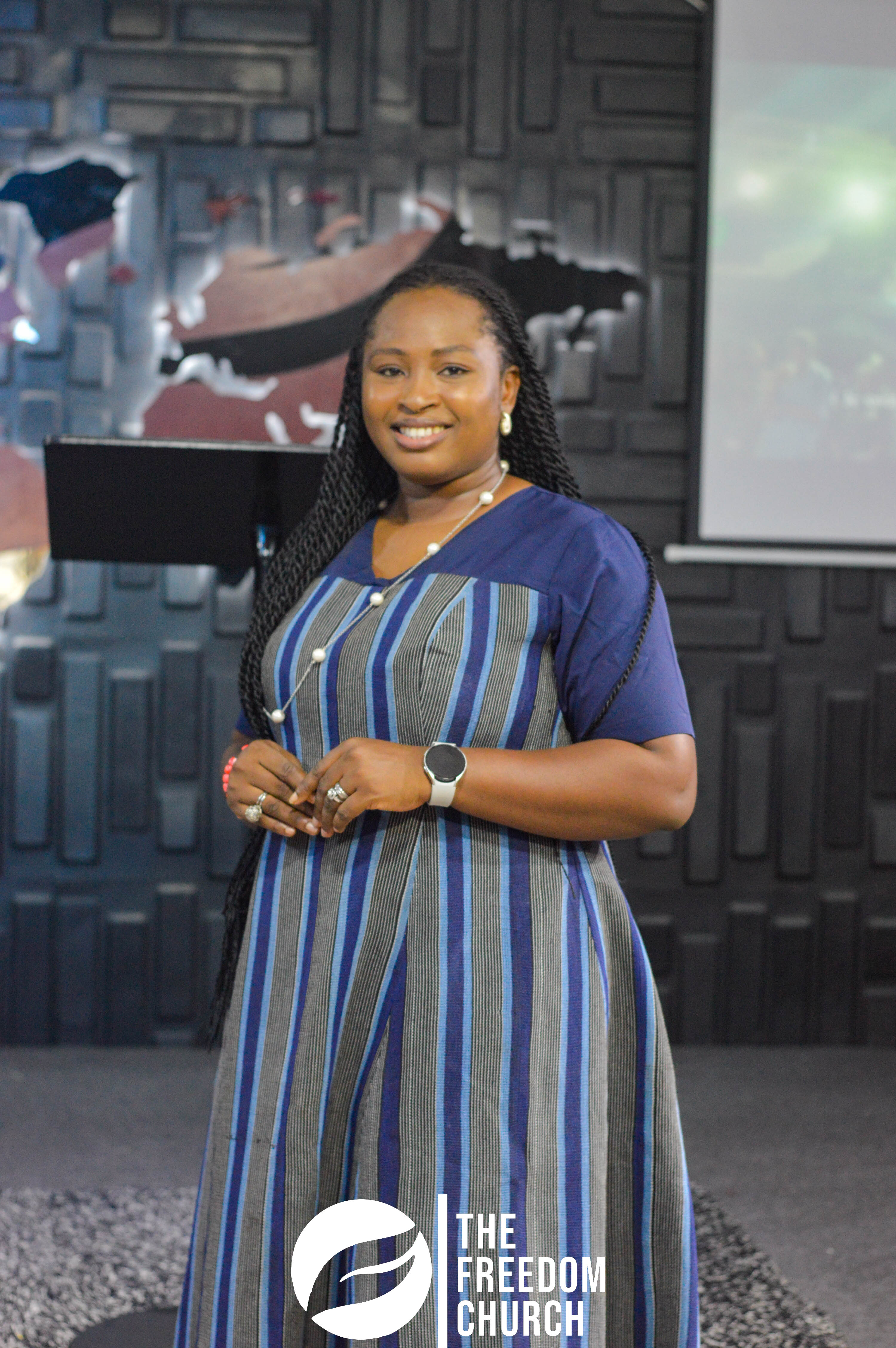 A member smiling at a Freedom Church event