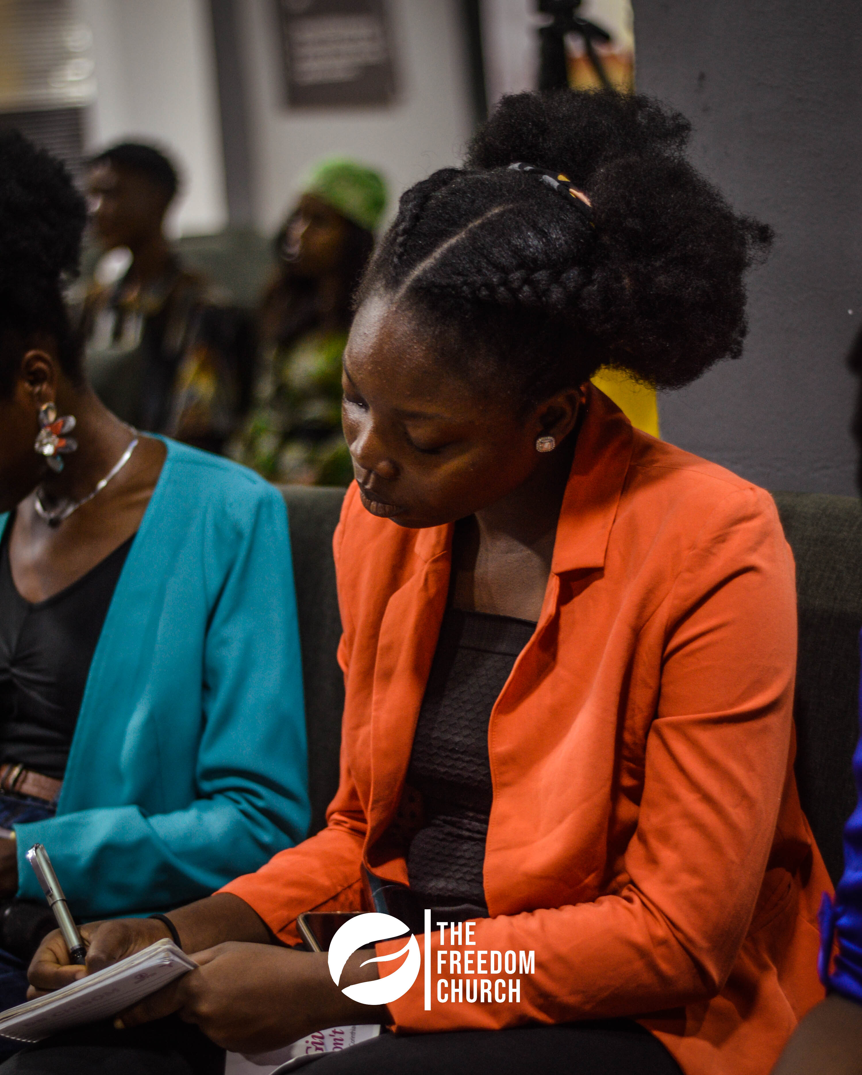 A member taking notes during service